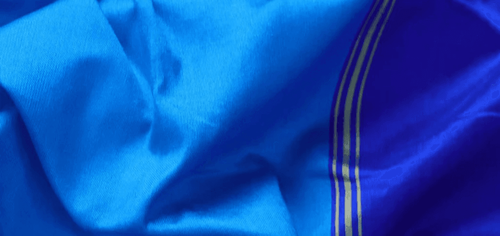 Electric blue silk saree with golden border stripes