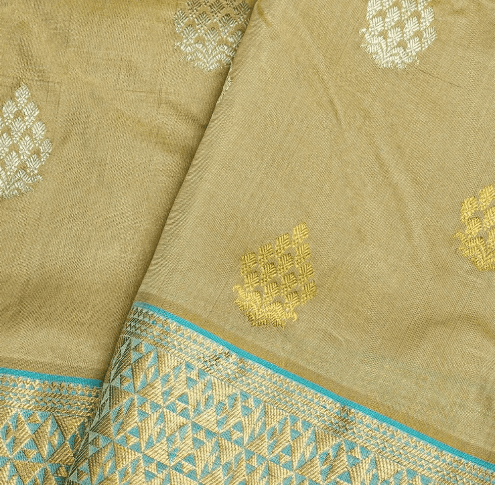 Mustard silk saree with gold and silver butas and teal zari border