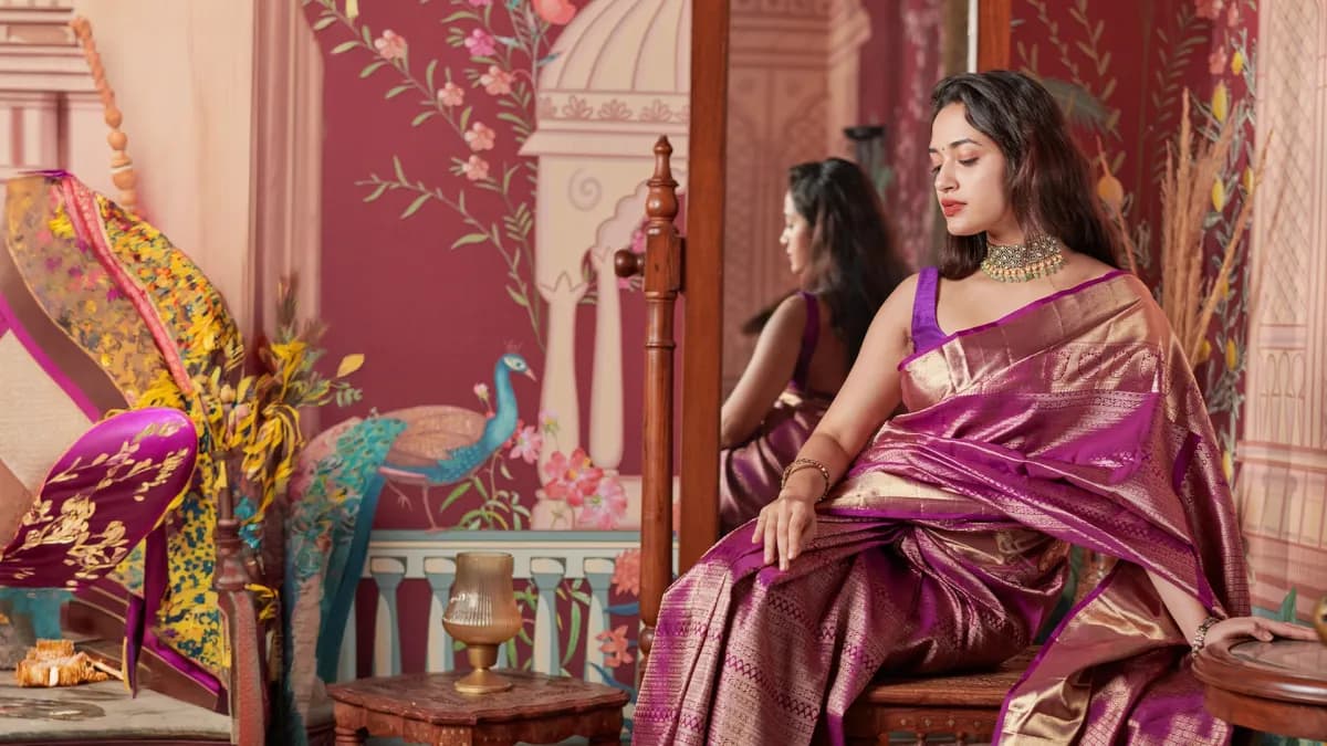 Woman in a green Kanjivaram saree reading